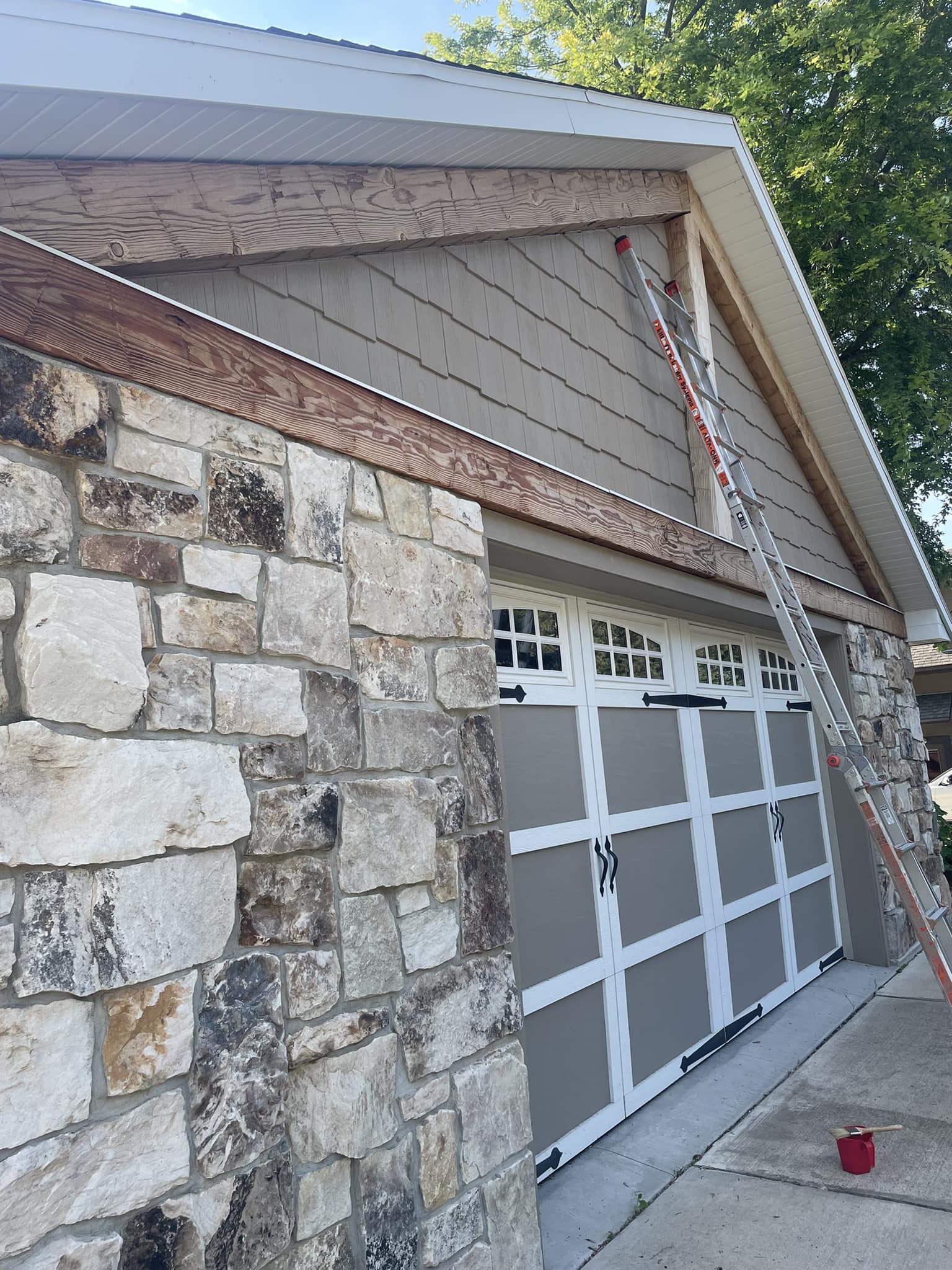 House with stone work and wooden gable construction details